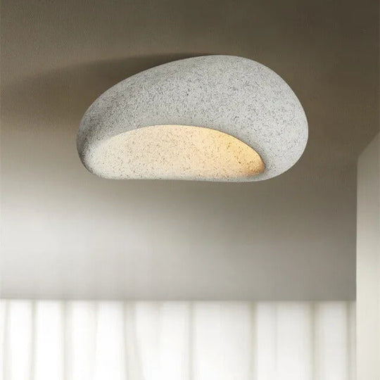 Sfeervolle plafondlamp met een minimalistisch design, ideaal voor een rustieke en moderne inrichting.