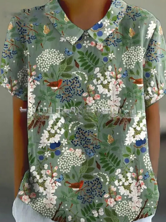 Mila Bloemen Shirt, stijlvol en comfortabel met een vrolijk bloemenpatroon.