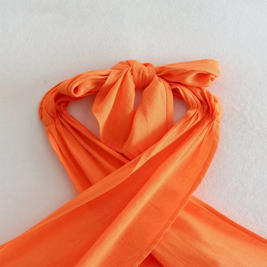 Mira | Korte haltertop met gekruist design voor dames | Oranje