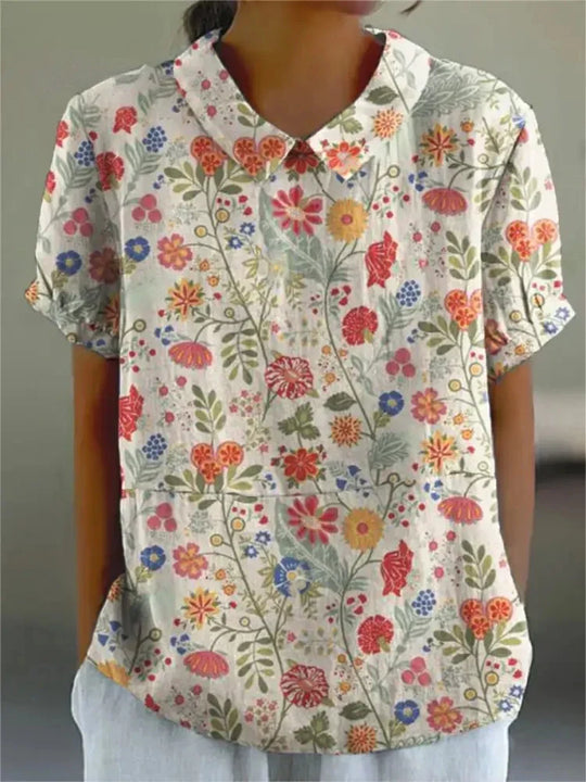 Mila Bloemen Shirt, perfect voor een casual zomerdag met bloemenmotief.